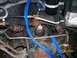 1995 Mercury Grand Marquis - Vehicle suspension components secured with blue straps, showing signs of rust. Date: 02/28/2009.