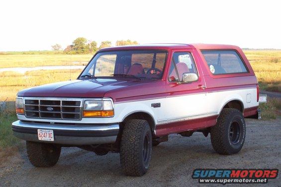 Red and white 1995 Ford Bronco, 3/4 front view