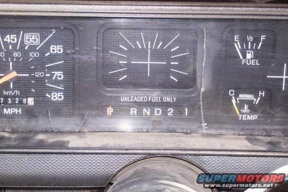 1986 Ford F-150 dashboard with speedometer, fuel gauge, and temperature gauge