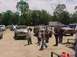 1993 Ford Bronco - Group gathered around multiple off-road vehicles in a dirt lot, with one possibly being a 1978 Ford Bronco.