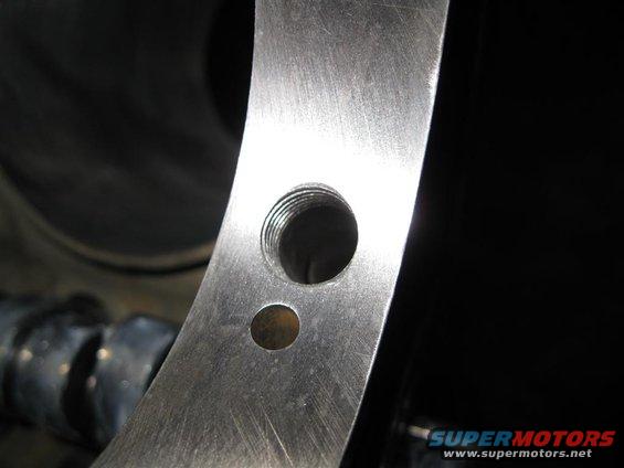 #1 main bearing feed opened up to 1/2" and tapped to 9/16" NF for a restrictor