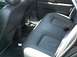 2002 Ford Taurus - The interior rear seats feature black leather upholstery with contrasting white accents along the bottom edge.