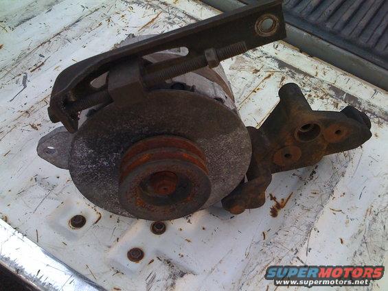 rusty alternator with pulley and mounting bracket