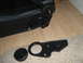 1990 Ford Bronco - A close-up shows a car seat's internal mechanism and a separate black knob.
