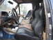 1990 Ford Bronco - The interior of this 1990 Ford Bronco features aftermarket bucket seats and a child safety seat.