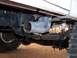 1995 Ford Bronco - Close-up view of the undercarriage and exhaust system of a vehicle.