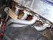 1995 Ford Bronco - Close-up view of an engine's exhaust manifold and pipes.