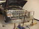 1979 Ford F-250 - A 1979 Ford F-250 Crewcab is shown with its hood open, supported by jack stands and a floor jack, ready for maintenance.