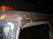 1979 Ford F-250 - Close-up of the roofline on a 1979 Ford F-250 Crewcab, showing an amber warning light.