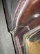 1979 Ford F-250 - This image shows a close-up view of the door jamb area of a vehicle, revealing the rubber seal and the painted metal frame.