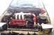 1994 Ford Probe - The engine bay of a car is shown with custom modifications and a red Ford valve cover.
