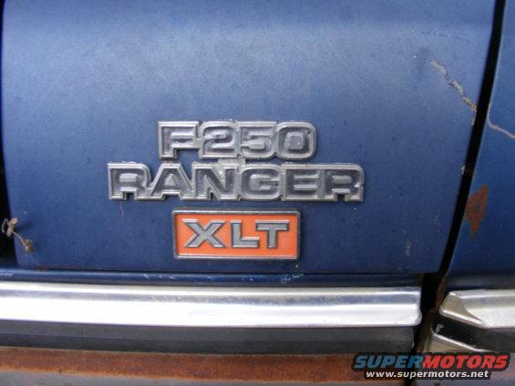 F250 Ranger XLT badging on the rear of a blue Ford truck.