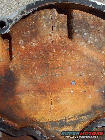 100_0112.jpg timing cover exterior crack under water pump housing