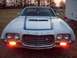1972 Ford Ranchero - Front view of a white 1972 Ford Ranchero, blue racing stripes on the hood and distinctive grille.