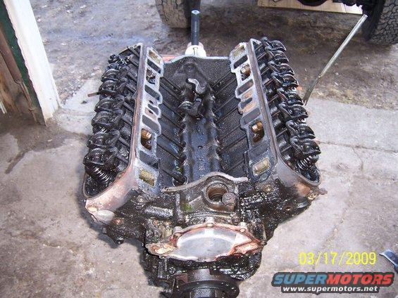 Engine block with valve covers removed, showing internal components