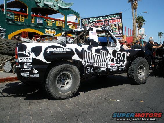 Black and white Ford F-150 SVT Lightning with custom graphics, 3q-front view