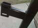 1990 Ford Bronco - Close-up view of a black metal frame component, likely part of a vehicle's suspension system.