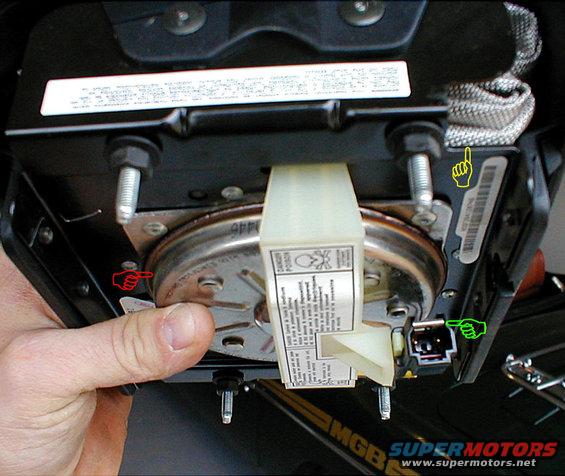 airbag.jpg This is the back of a '94-96 airbag, the same for most Ford cars & trucks.
Red: shaped charge
Yellow: airbag
Green: shorting clip inside connector prevents static from detonating the charge while unplugged

Any time an airbag is uninstalled, it should be placed face-up (fasteners DOWN) under the vehicle.  If it accidentally deploys, it will stay where it is, and not throw anything.

See also:
[url=https://www.supermotors.net/registry/media/1170338][img]https://www.supermotors.net/getfile/1170338/thumbnail/airbagcircuit96.jpg[/img][/url] . [url=https://www.supermotors.net/registry/6098/31472-4][img]https://www.supermotors.net/getfile/701936/thumbnail/steeringcolumn92up.jpg[/img][/url] . [url=https://www.supermotors.net/vehicles/registry/media/434182][img]https://www.supermotors.net/getfile/434182/thumbnail/shiftercableadjustments.jpg[/img][/url] . [url=https://www.supermotors.net/vehicles/registry/media/894814][img]https://www.supermotors.net/getfile/894814/thumbnail/column9296tiltex.jpg[/img][/url] . [url=https://www.supermotors.net/vehicles/registry/media/185358][img]https://www.supermotors.net/getfile/185358/thumbnail/steering-column-wairbag.jpg[/img][/url] . [url=https://www.supermotors.net/vehicles/registry/media/440136][img]https://www.supermotors.net/getfile/440136/thumbnail/steeringcolumn92up.jpg[/img][/url]