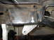 1991 Ford Bronco - This photo shows a modified vehicle frame, possibly for off-road use, with a custom bracket welded on.