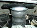 2005 Ford F-250 - This is a close-up view of an Air Lift air spring, a component of the vehicle's suspension system.