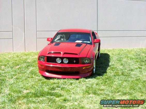 Red sports car on grass