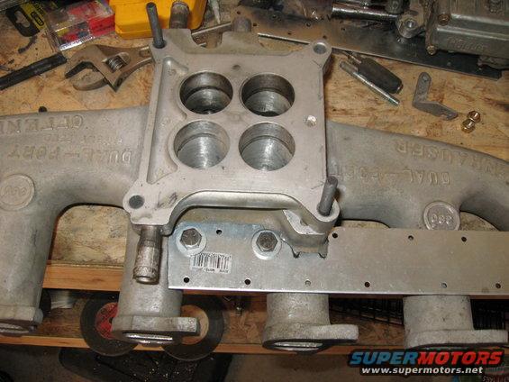 bracket-in-place.jpg 
The custom accelerator bracket bolted to the manifold.  I used the bolt holes that normally bolted the intake to the stock 1bbl exhaust.

