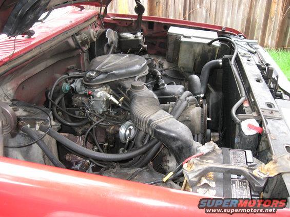 engine-bay.jpg 
Here's a shot of the mostly stock engine bay.   The only thing in this picture that isn't completely stock is the EFI 300 exhaust manifolds.  It's time to dig in.

