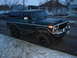 1978 Ford Bronco - Dark green 1978 Ford Bronco with lifted suspension parked on a street in winter.