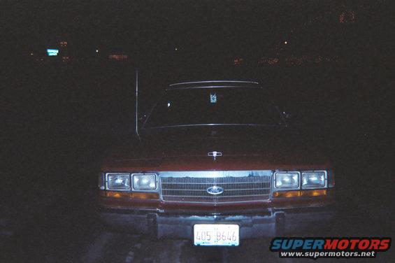 004_1.jpg Crappy front pic of my car.