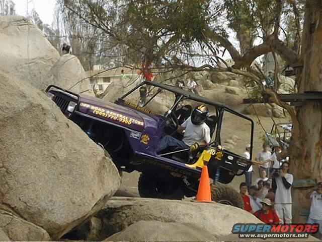 Purple off-road vehicle climbing rocks, with "OFF ROAD GENERAL STORE" text