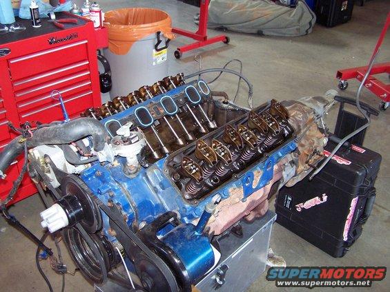 100_1220.jpg tear down has started; intake manifold has been removed already, accessories and the heads are next.