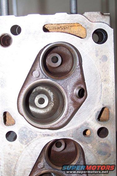 100_0844.jpg These are the 'Aussie' 302C iron heads I initially used; the Cleveland was only produced in North America for four years, '70, '71, '72, & '73, but it was produced in Australia for 15 years until 1985!

These heads have the small 58cc chambers that the 4 barrel 'American' heads had, with the smaller intake ports of the &quot;American&quot; 2 barrel heads, for better street performance.

They also used the &quot;smaller&quot; 2 barrel ports that work a lot better in a street engine than the humongous 4 barrel ports, which work better for high rpm race engines.

I did a little porting in the area under the valve and cleaned up the ports, then had bronze guides installed along with hardened exhaust seats, a three angle valve job and bigger stainless steel valves.