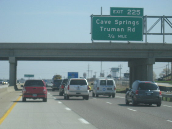 Highway traffic with a red truck, white SUV, and dark SUV