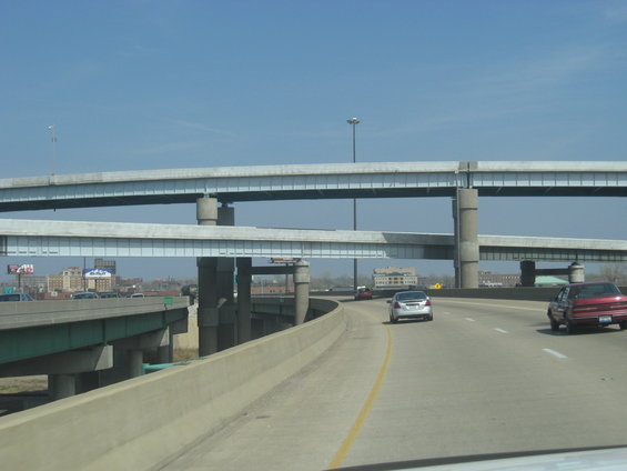 Cars on highway with multiple elevated overpasses overhead
