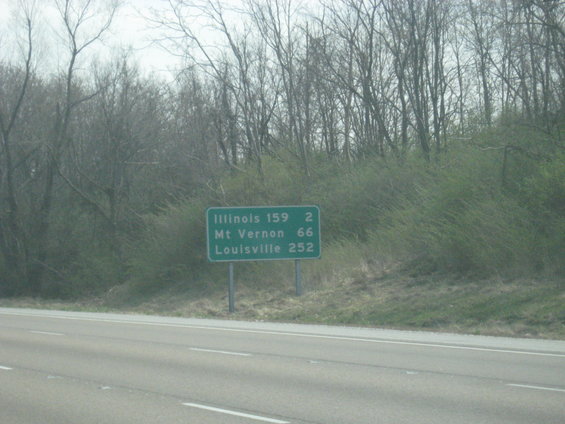Green highway sign with destinations Illinois, Mt Vernon, and Louisville