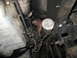 1995 Ford C-350 (Centurion Conversions) - Close-up of vehicle transmission and oil filter assembly, showing various mechanical parts.