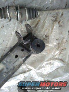 suspension control arm and shock absorber assembly on plastic sheeting