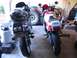 1992 Yamaha FZR600 - Two motorcycles are parked side-by-side in a garage setting, with various items in the background.
