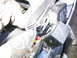 1992 Yamaha FZR600 - A gloved hand manipulates electrical relays and fuses, likely for a motorcycle's electrical system.