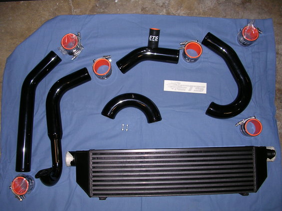 Black intercooler piping kit with red silicone couplers and ETS logo sticker