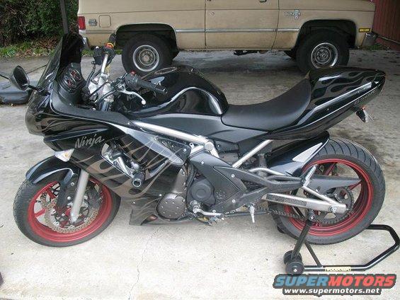 2008 Kawasaki Ninja R sportbike, black with flame decals, on a rear stand