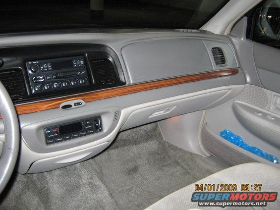 1997 Ford Crown Victoria interior dashboard with wood trim, radio, and air vents