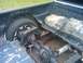 2000 Ford F-150 - The rear section of a 2000 Ford F-150 pickup truck bed is visible, with components like the axle and fuel tank exposed.