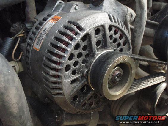 close-up of car alternator with belt