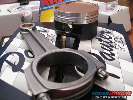 Connecting rod and piston on a box labeled 'auter RODS'
