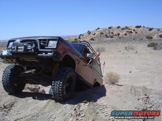 1986 Ford Bronco II off-roading with lifted suspension and large tires