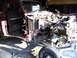 1994 Ford F-250 - Front view of a 1994 Ford F-250 undergoing disassembly in a garage.