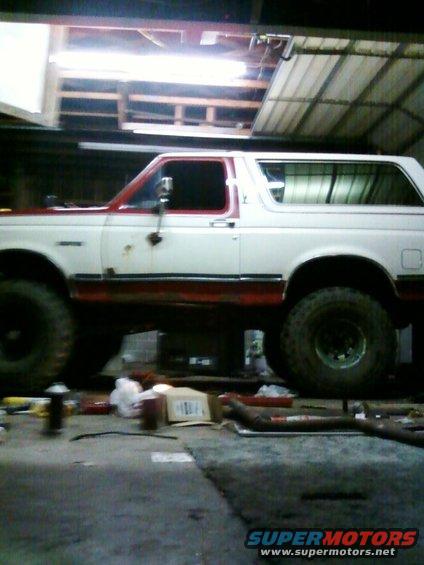 Side view of a white and red 1991 Ford Bronco