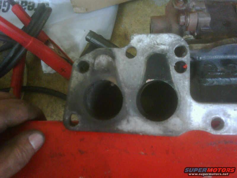 Close-up of an engine intake manifold with two large ports