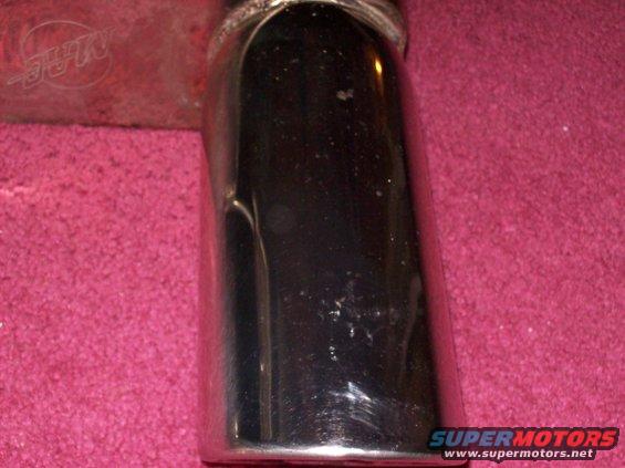 Chrome exhaust tip with MAC logo visible